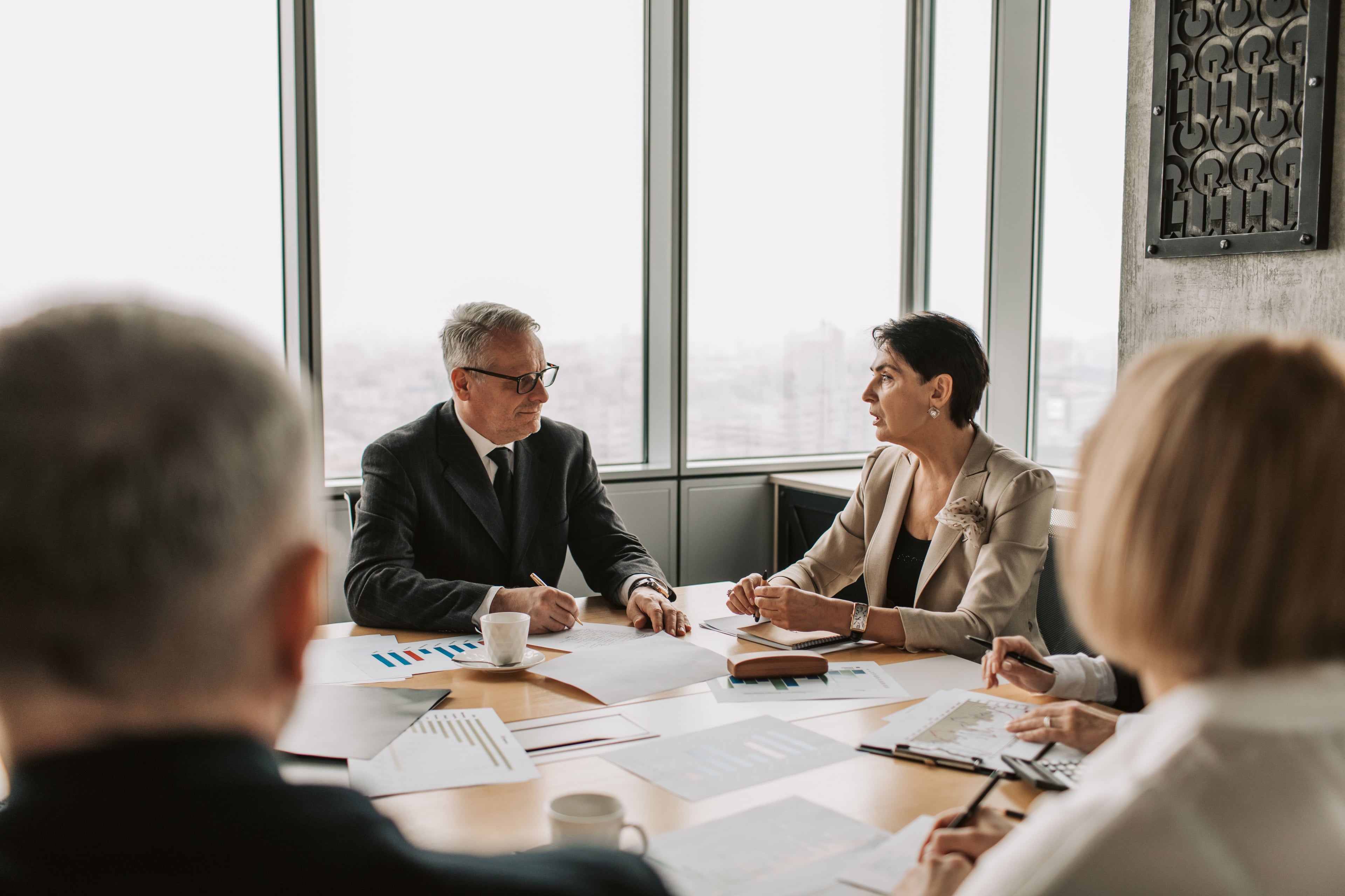 Experienced professionals listening during a business meeting
