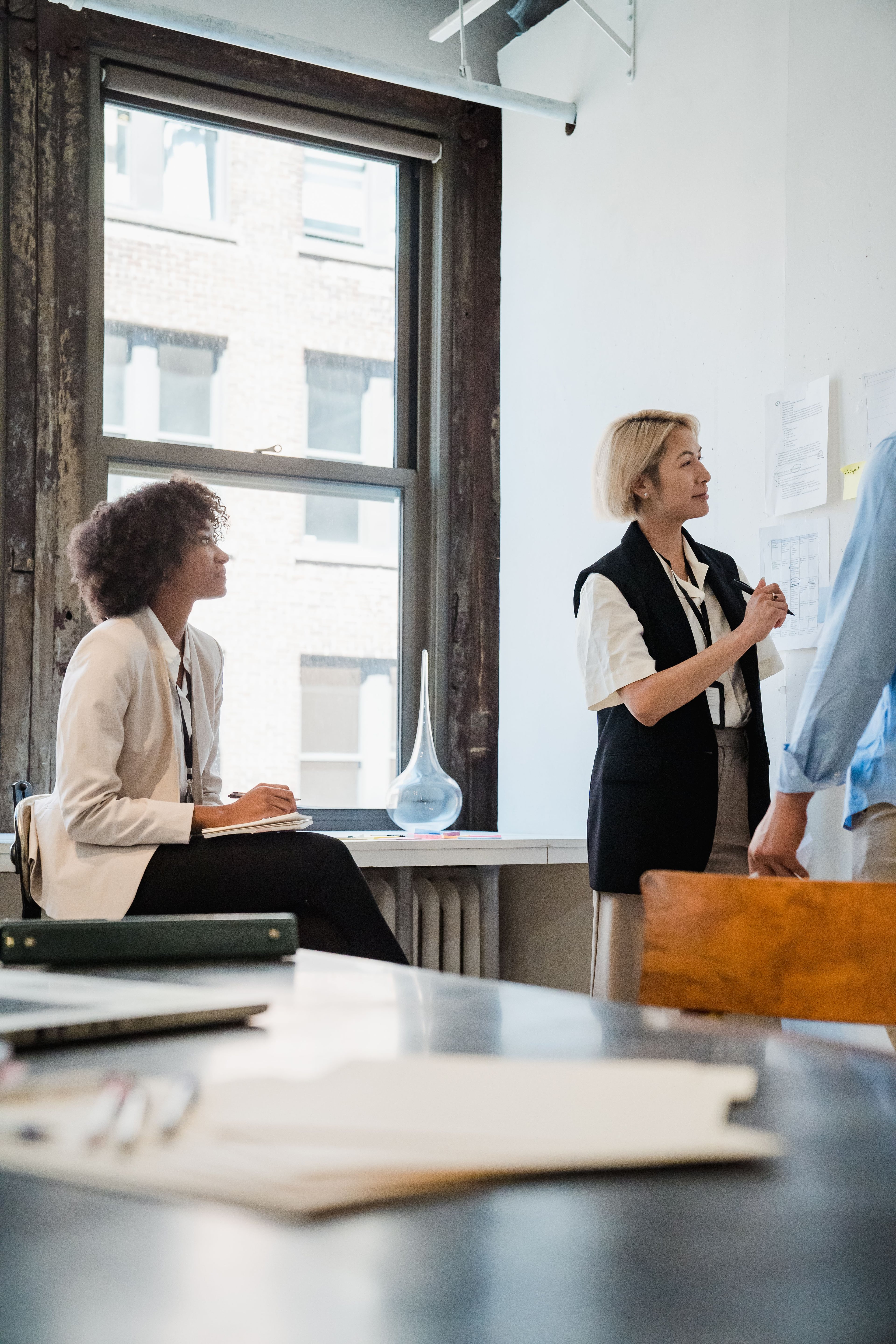 Colleagues exchanging ideas during a workplace workshop