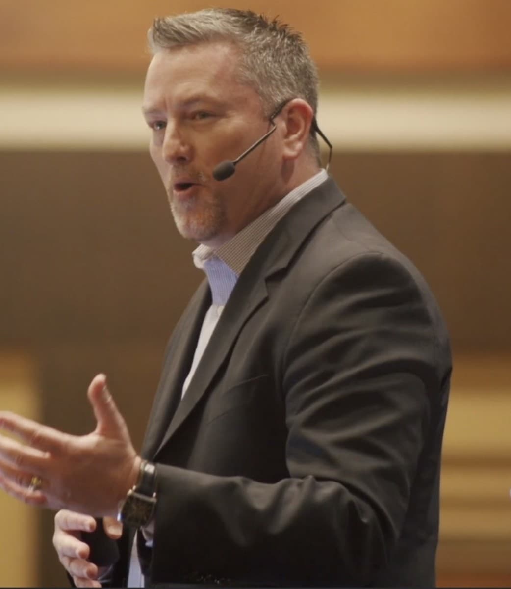 Mike McCloskey speaking on stage