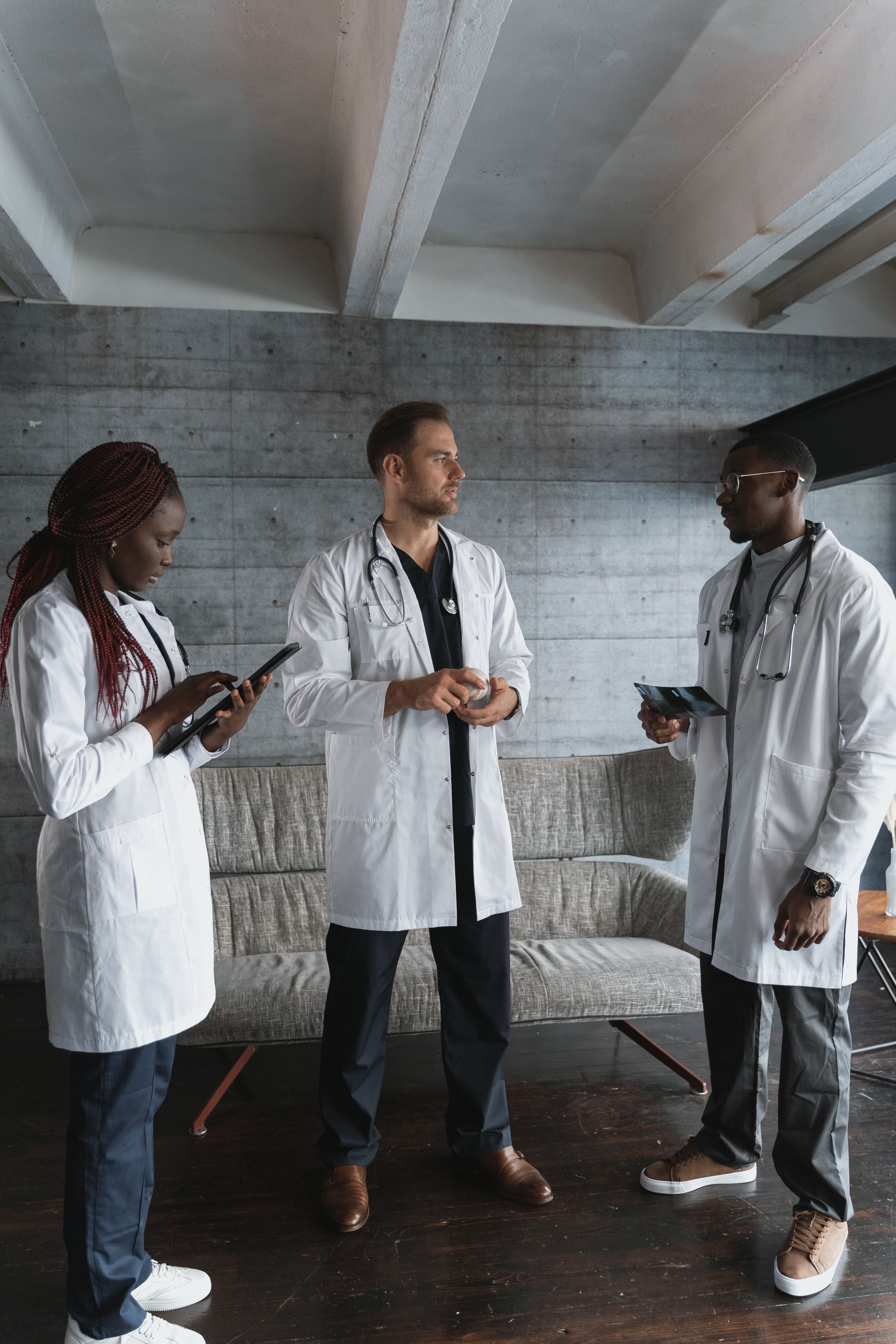 Clinical colleagues discussing information on a tablet