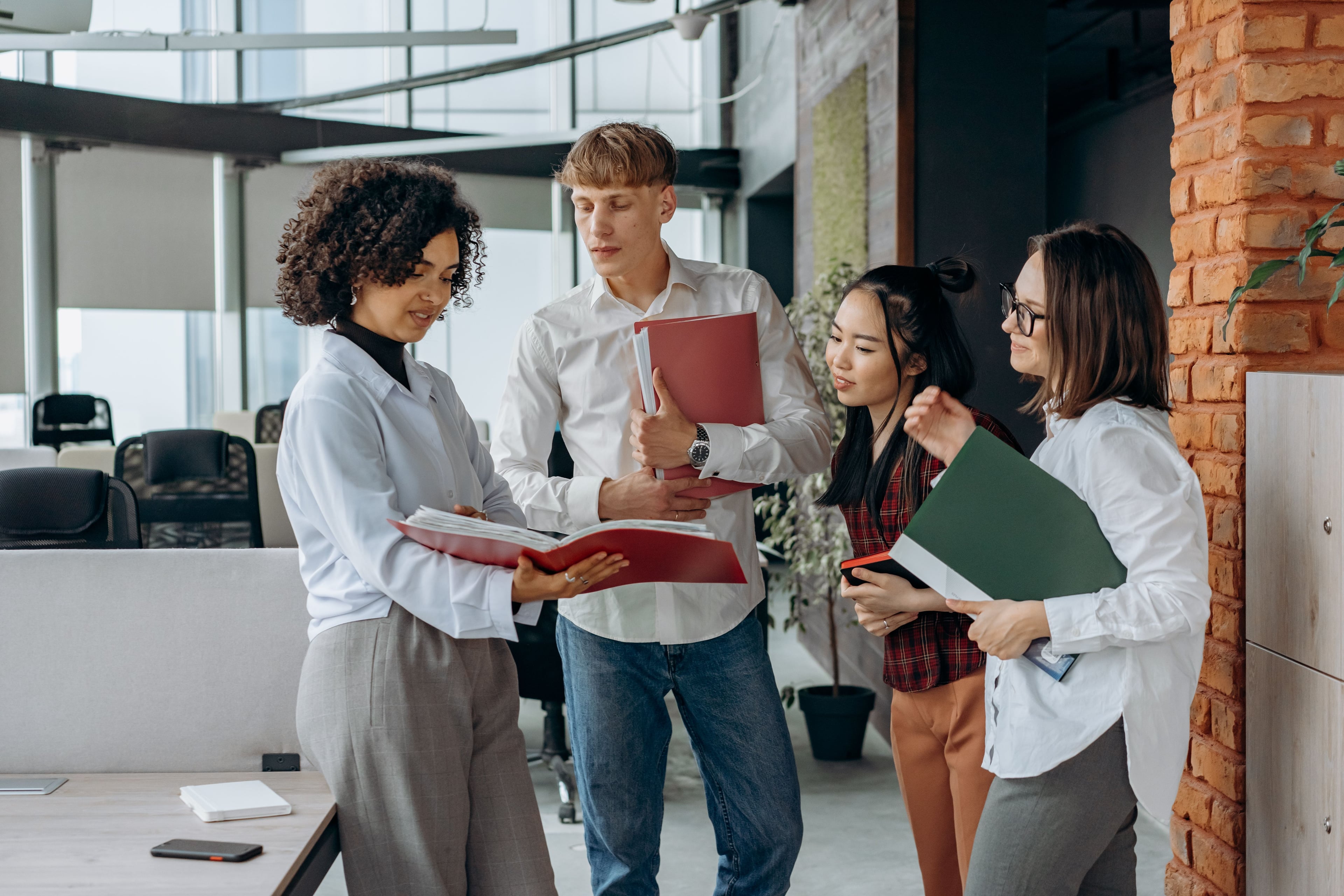 A group reviewing documents together in an office