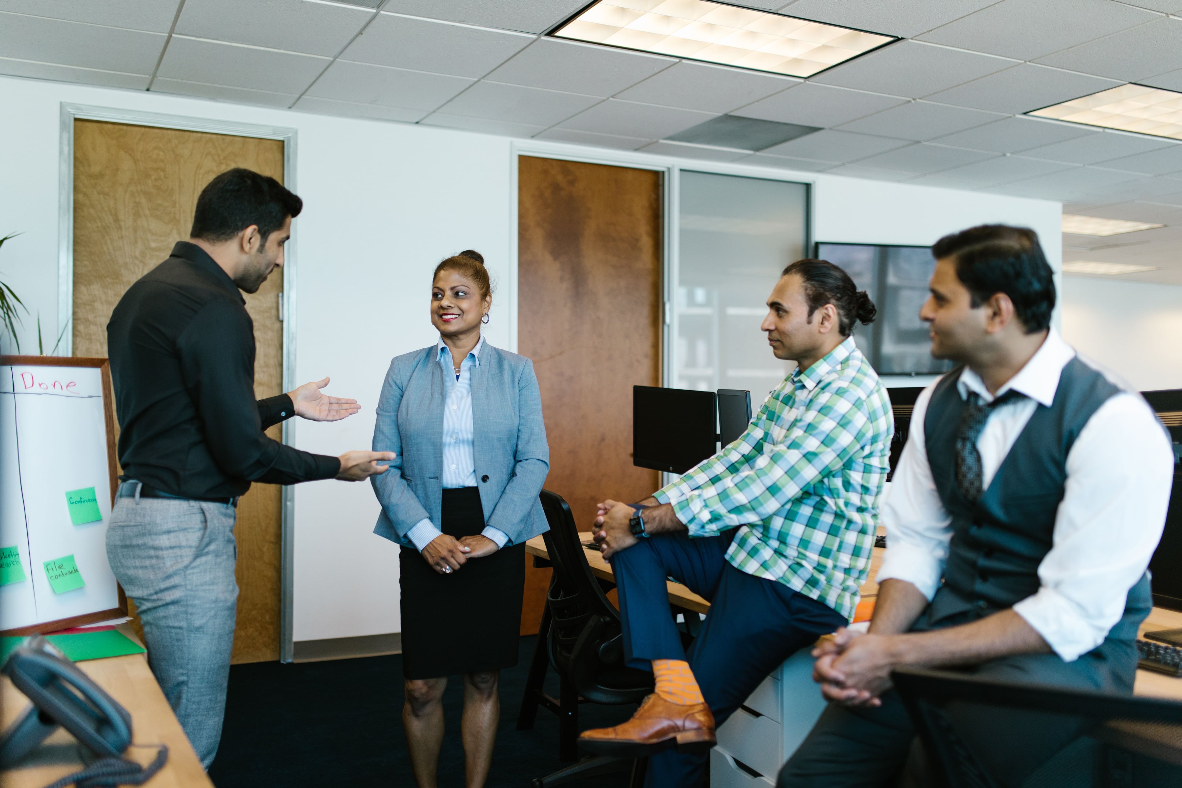 Colleagues listening during a small office discussion