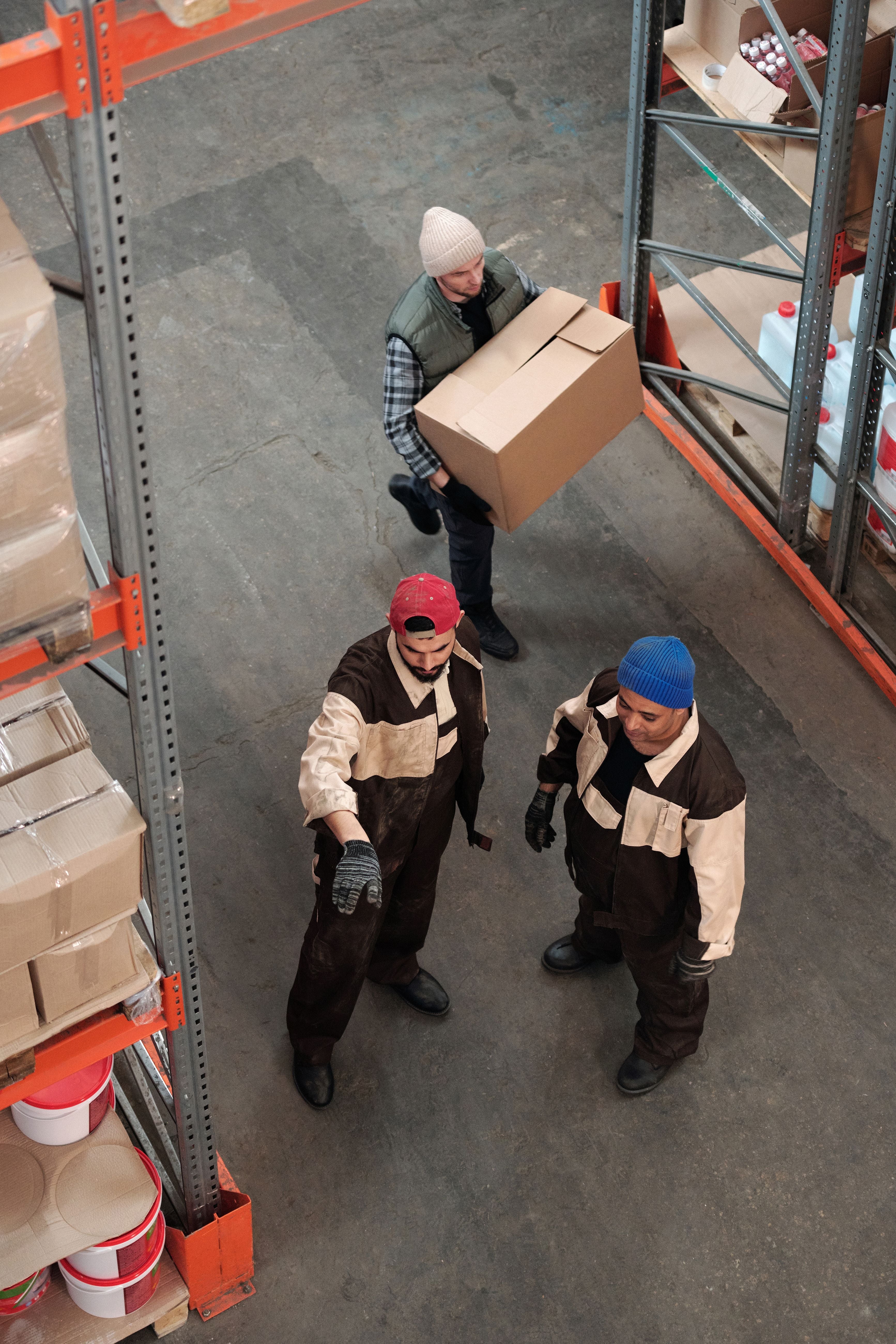 Warehouse colleagues organizing boxes and checking stock