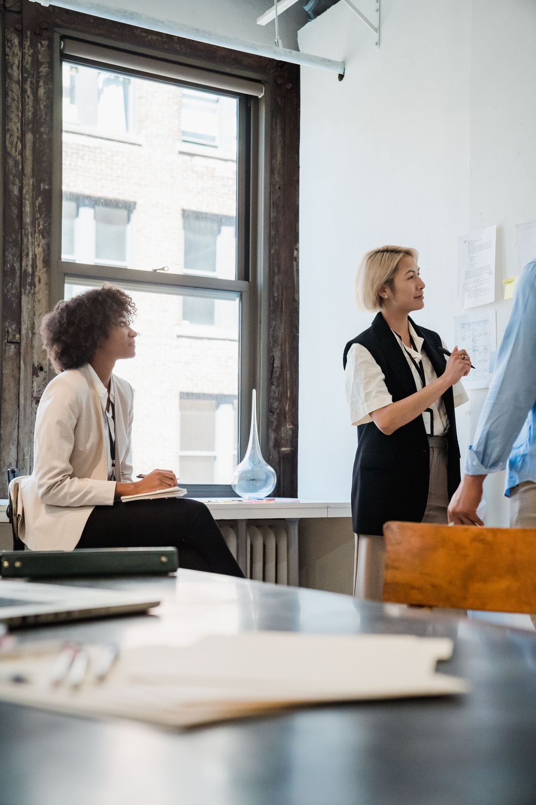 Colleagues exchanging ideas during a workplace workshop